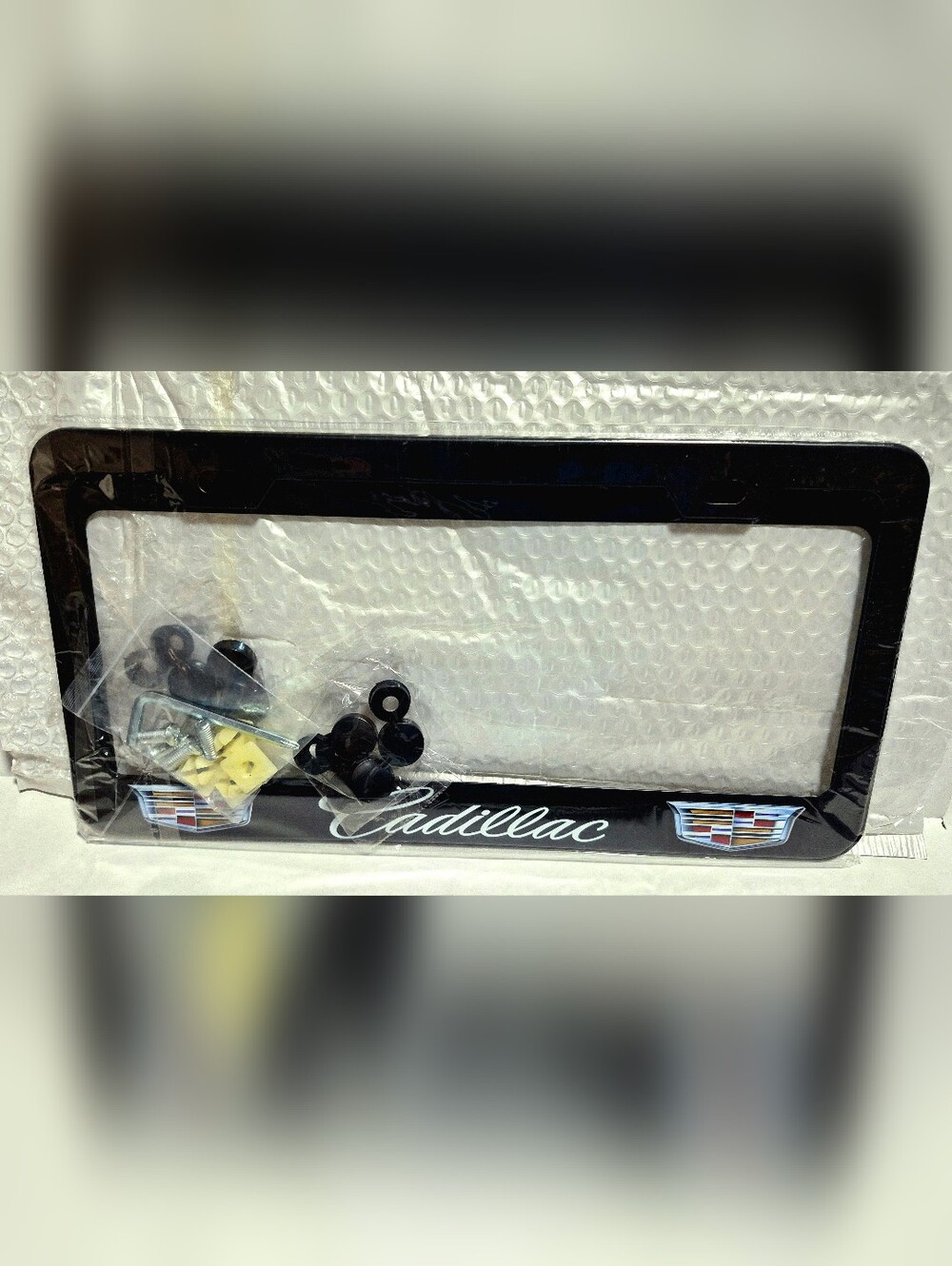 Black CADILLAC License Plate Frame with Crest Emblems